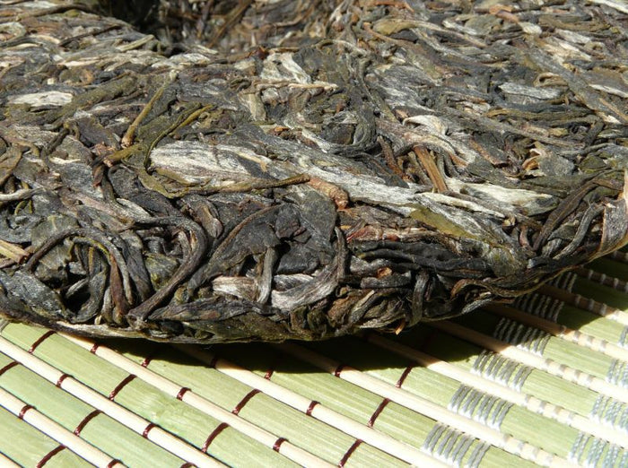 2009 Yunnan Sourcing * Road to Yi Wu "Man Zhuan" Raw Pu-erh Tea Cake | Yunnan Sourcing Tea Shop