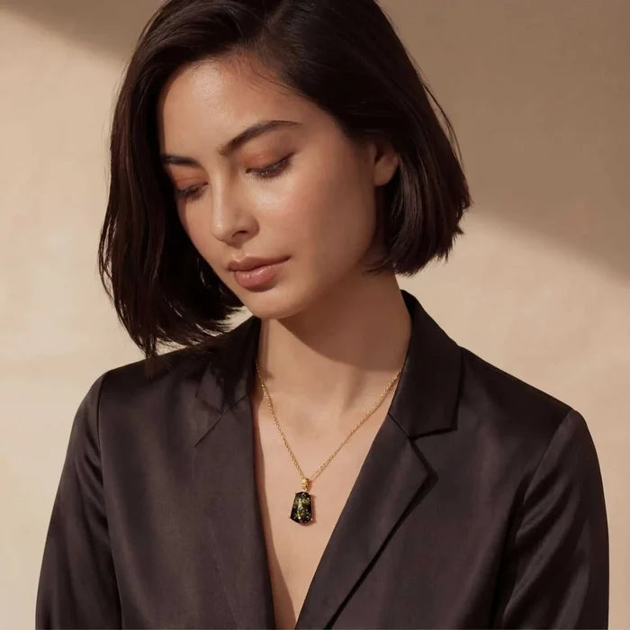 Forest Gold Green Amber Pendant Necklace with a rectangular mottled green and gold stone in a gold-tone setting on a fine chain