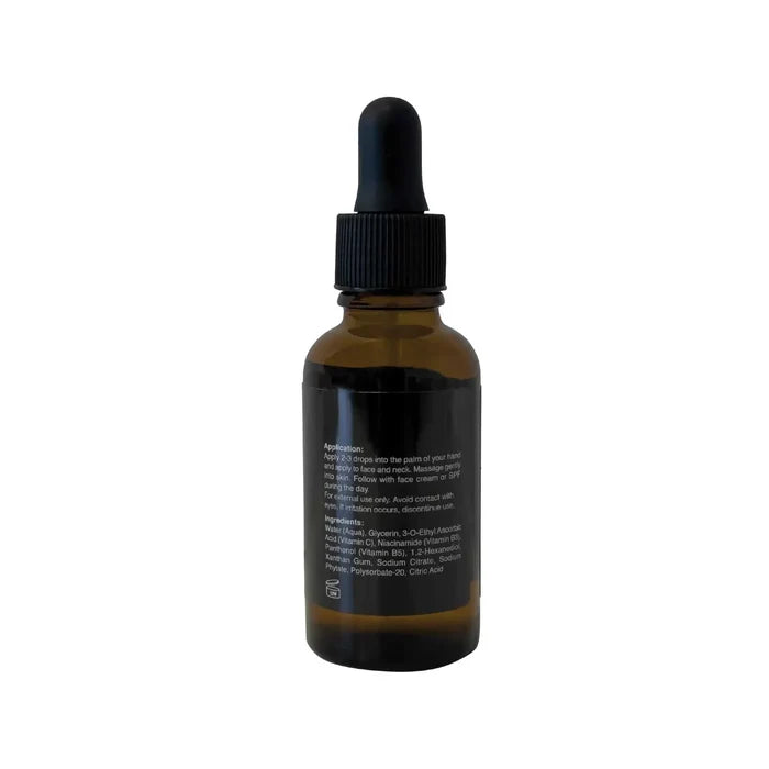 Niacinamide Vitamin Boost Serum in a dark amber glass dropper bottle with a black cap and pipette