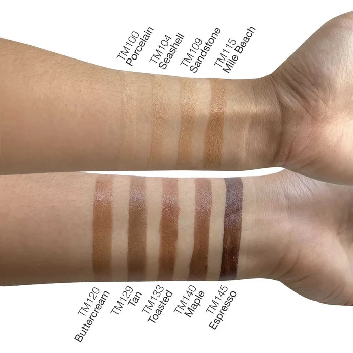 Tinted Moisturizer - Porcelain swatched on arms, showing a light beige shade alongside several deeper tinted shades