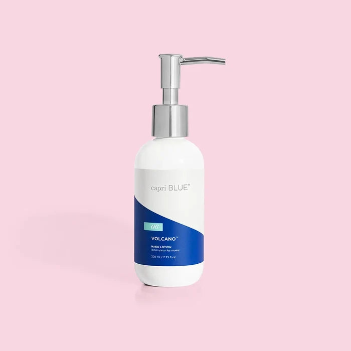 A pump bottle of volcano hand lotion against a pink background.