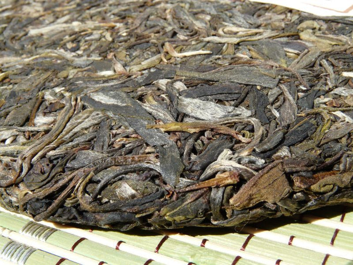2009 Yunnan Sourcing * Road to Yi Wu "Man Zhuan" Raw Pu-erh Tea Cake | Yunnan Sourcing Tea Shop