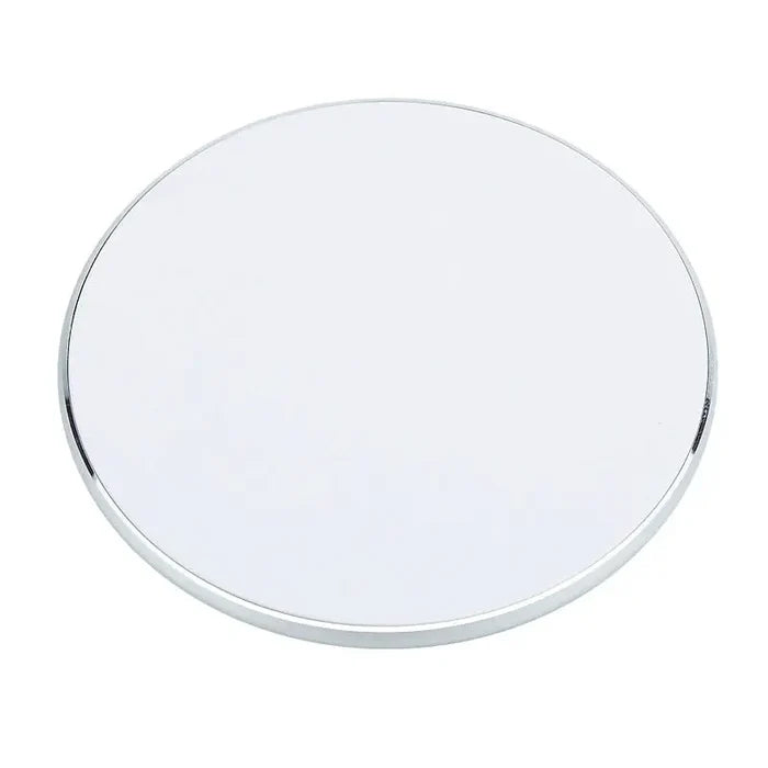 a round mirror with a white background