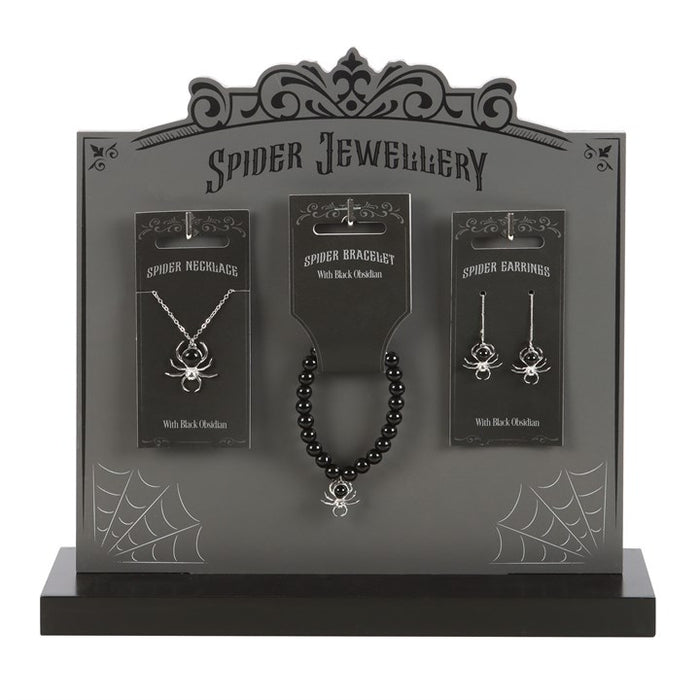 obsidian spider jewellery collection displayed on stand featuring necklace earrings and bracelet