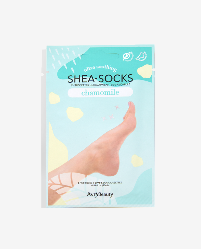 Packaging of Shea Socks pedicure socks with chamomile, showing the product and brand name, and an image of a foot wearing the sock.