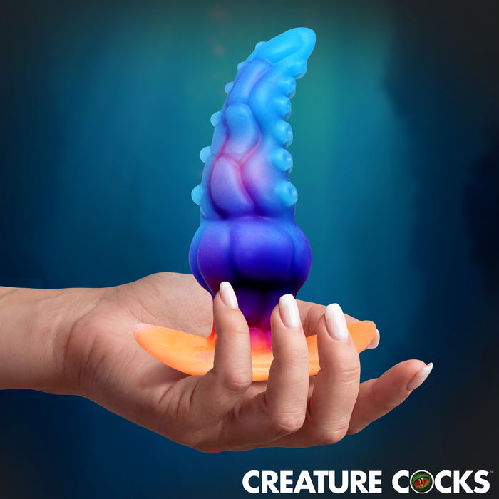 GLOWTOPUS glow-in-the-dark textured silicone anal plug by Creature Cocks for fantasy exploration