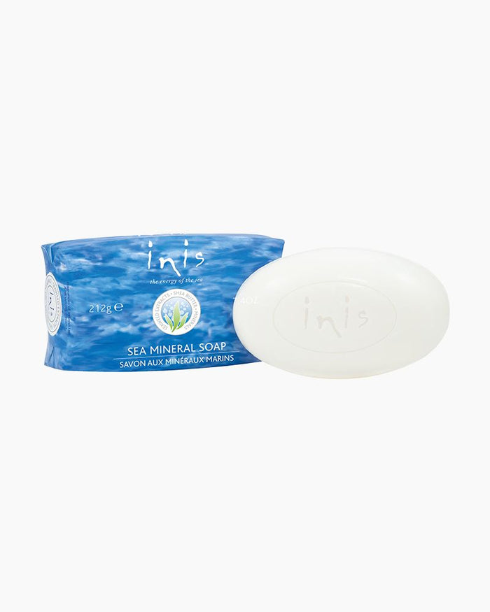 Inis Soap packaged in a blue and white wrapper with the Inis brand logo, revealing a white bar of soap inside.
