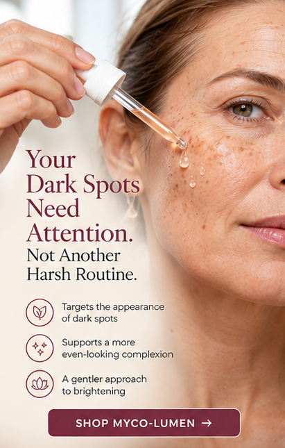 Woman applying MYCO-LUMEN Gentle Dark Spot Serum with a dropper