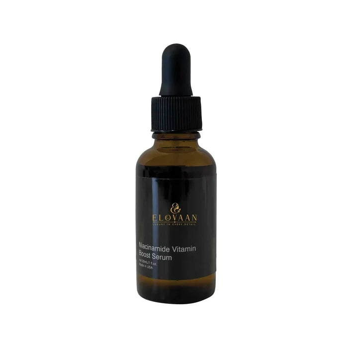 Niacinamide Vitamin Boost Serum in a dark amber glass dropper bottle with a black cap and gold label