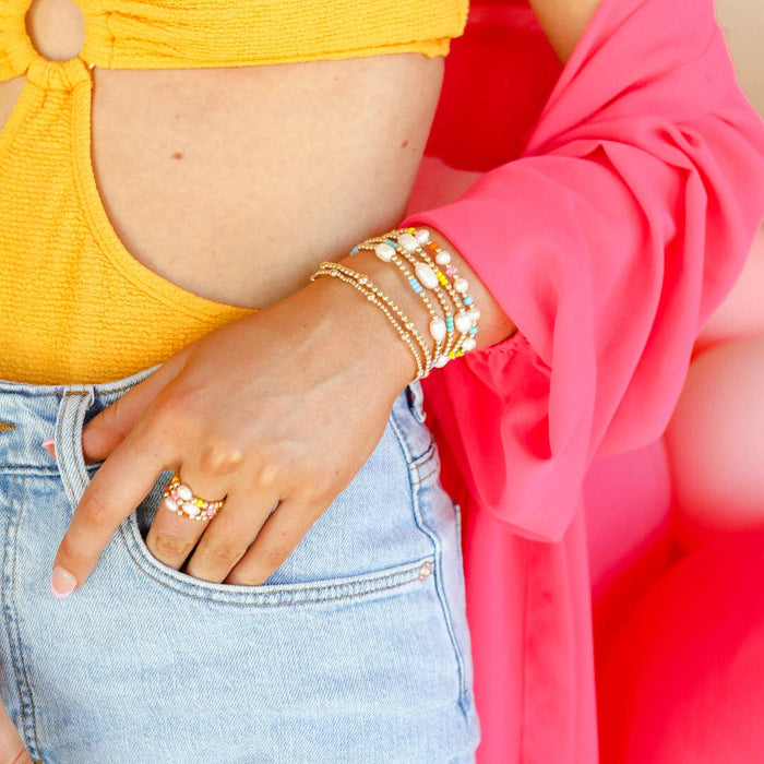 a person wearing a bracelet stack