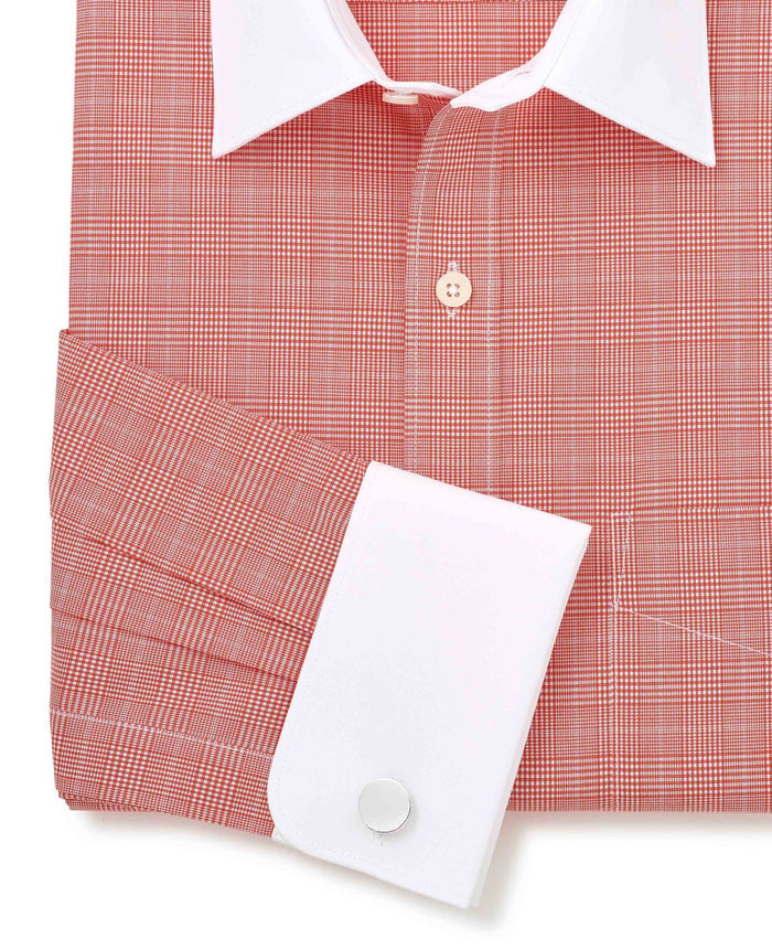 Red checkered shirt with white collar and cuff on a white background. Cuff detail