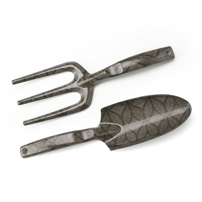 A collection of gardening tools with floral patterns, including a shovel, rake, and other hand tools.