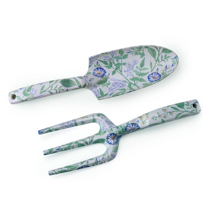 A collection of gardening tools with floral patterns, including a shovel, rake, and other hand tools.