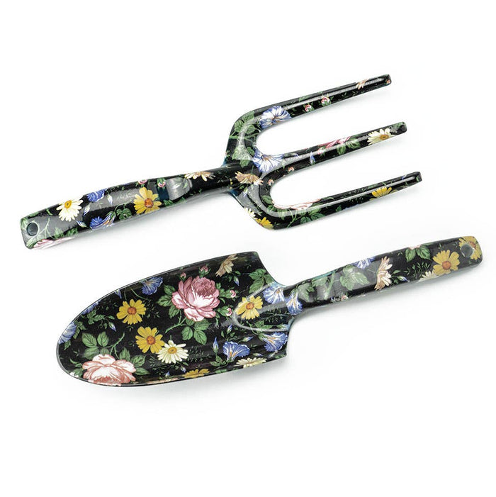 A collection of gardening tools with floral patterns, including a shovel, rake, and other hand tools.