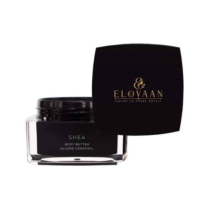 Shea Body Butter in a clear rectangular jar with a black lid and black label featuring gold lettering