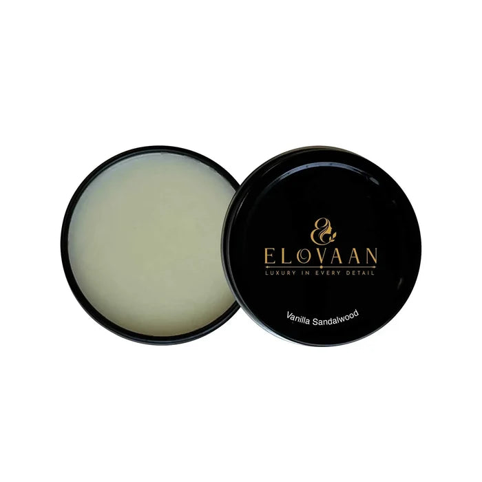 Solid Fragrance - Vanilla Sandalwood in a black round tin, shown open with pale balm and a branded lid.