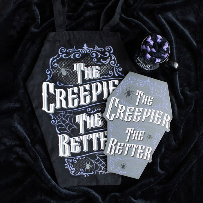 alternative coffin bag laid on dark fabric highlighting bold statement shape