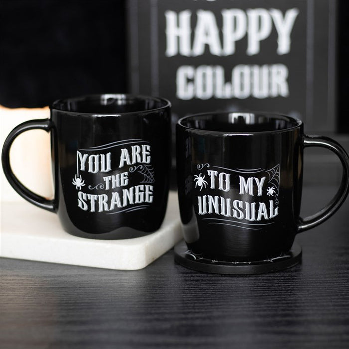 you are the strange to my unusual gothic mug set styled together in home setting